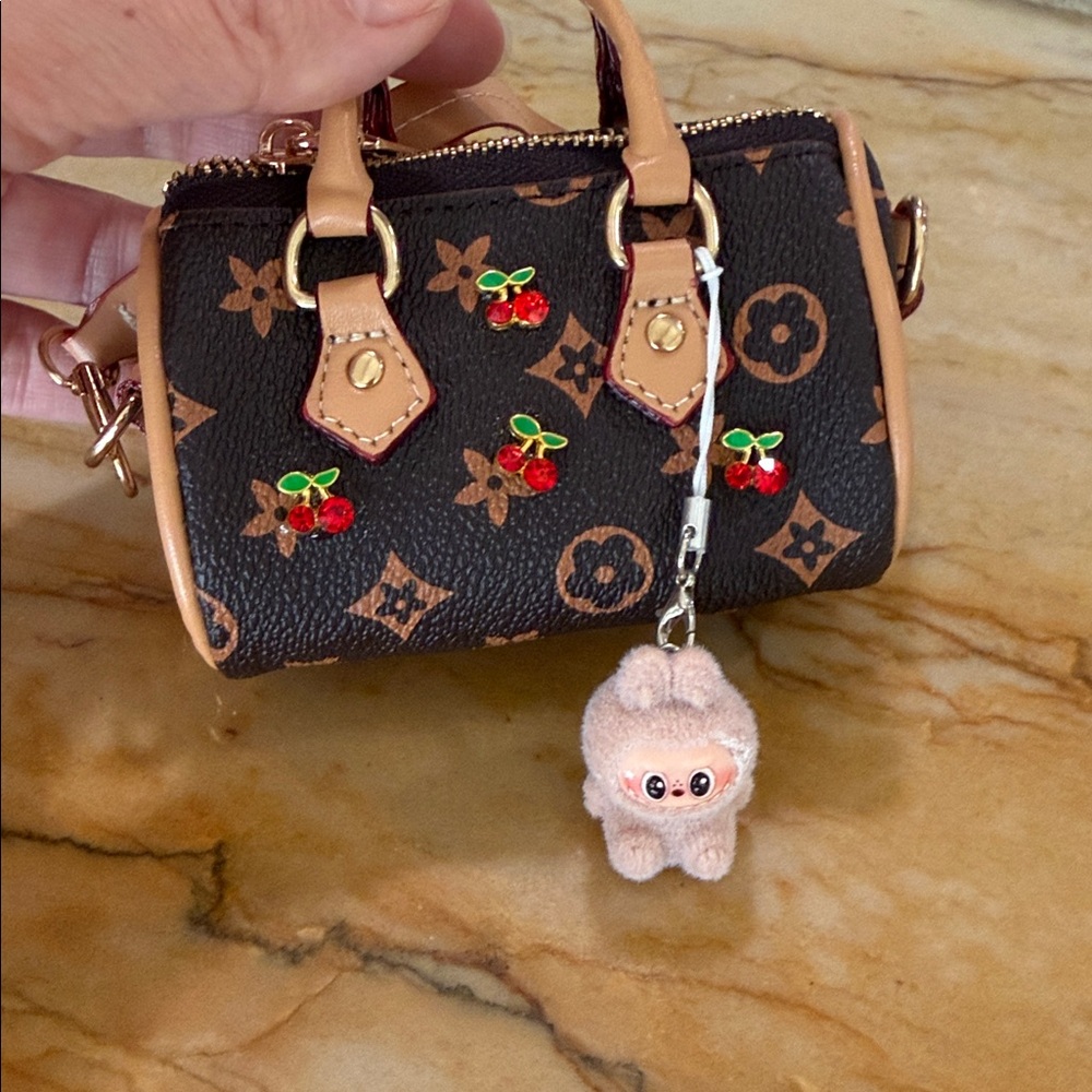 Miniature Vuitton Murakami cherry speedys with baby labubu charms